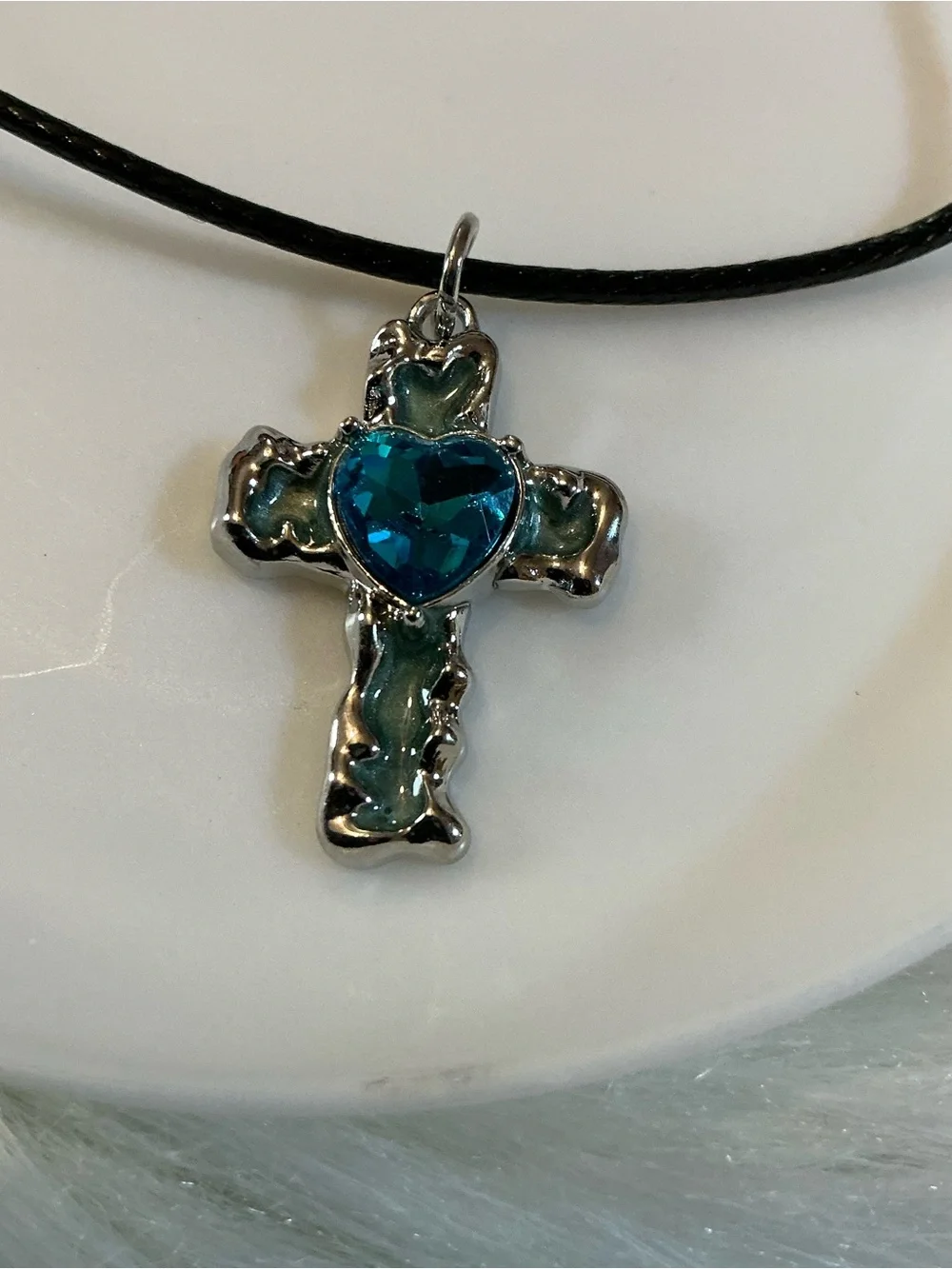 Pretty blue/silver-tone cross/religious pendant black string necklace
